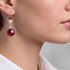 Close-up of 14 mm rub earrings on model