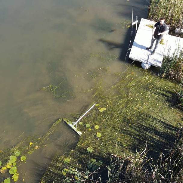Rake Zilla Skimming Floating Weeds in lake using float and rope kit