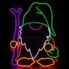 This photo showcases a charming 36" LED Neon Standing Gnome with Hiking Stick, adding whimsical flair to any space. Adorned with vibrant LED neon lights, the gnome exudes a playful and inviting glow, while holding a hiking stick in one hand, adding a touch of adventure to his character. The neon lights outline the gnome's silhouette, casting a warm and inviting ambiance that brightens up the surroundings.