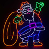 This photo features our charming 46" LED Neon Waving Santa with Toy Bag Display, a heartwarming addition to your holiday décor. Standing tall at 46 inches, Santa Claus is depicted with a cheerful expression, and a friendly smile as he joyfully waves to all. Adorned with vibrant LED neon lights, Santa's silhouette illuminates with a playful and inviting glow, creating a festive ambiance. With his beautifully crafted toy bag filled with presents by his side, this waving Santa adds a touch of magic and holiday spirit to any room or outdoor area.