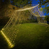 A stunning 10' x 30' warm white LED light curtain is gracefully displayed, with 3,600 tiny glowing lights cascading down in evenly spaced rows. The warm white light creates a soft, inviting ambiance, ideal for festive events or cozy décor. The expansive size provides a dramatic effect, covering a large walls, windows, or outdoor spaces. The gentle glow of the LEDs beautifully illuminates the surroundings, offering a magical, twinkling backdrop perfect for any occasion.
