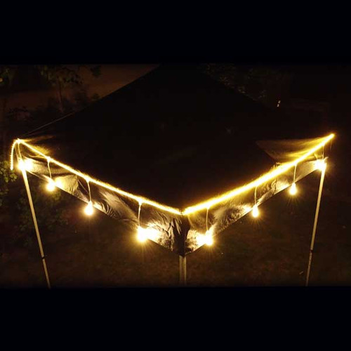 The photo showcases a stunning 25ft LED Rope Light elegantly draped inside a wedding tent. The rope light features 12 evenly spaced E27 drops, each emitting a soft, warm glow that bathes the space in a romantic ambiance. The lights are intertwined with delicate greenery and white fabric, adding a touch of sophistication and charm. The warm, inviting illumination highlights the beautifully set tables and décor, creating a magical atmosphere perfect for an evening celebration. The overall scene is one of enchantment, with the LED lights adding a timeless elegance to the event setting. The photo showcases a stunning 25ft LED Rope Light elegantly draped inside a wedding tent. The rope light features 12 evenly spaced E27 drops, each emitting a soft, warm glow that bathes the space in a romantic ambiance. The lights are intertwined with delicate greenery and white fabric, adding a touch of sophistication and charm. The warm, inviting illumination highlights the beautifully set tables and décor, creating a magical atmosphere perfect for an evening celebration. The overall scene is one of enchantment, with the LED lights adding a timeless elegance to the event setting.