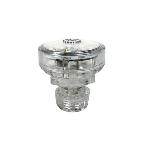 White LED puck light with a translucent green housing and clear threaded base on a white background.