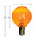 Orange incandescent light bulb with a round G-style globe and an E12 candelabra screw base. The bulb measures approximately 1 5/8 inches in height and 1 inch in diameter, and the glowing filament is clearly visible inside the transparent colored glass.