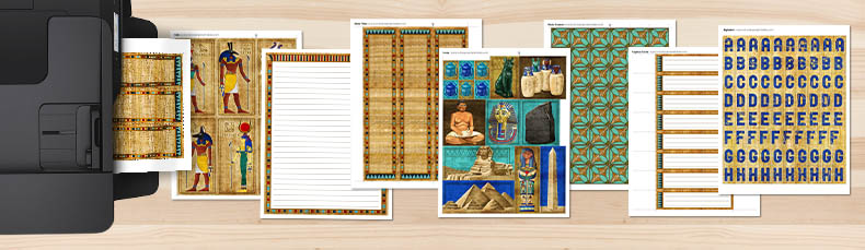 Pages included in the Ancient Egypt Printable Kit coming out of a printer onto a table