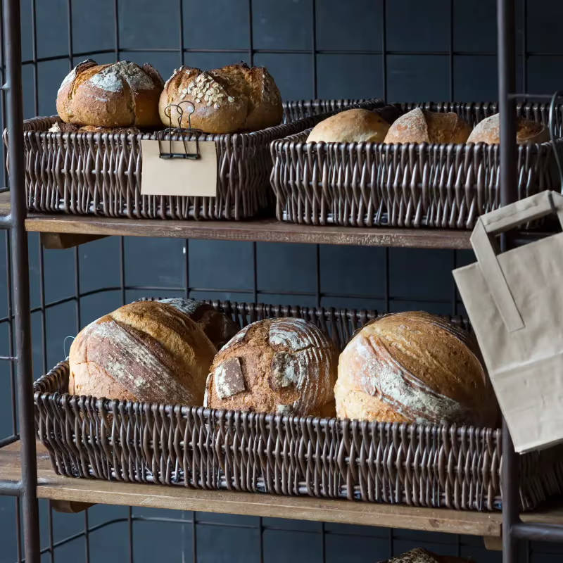 Bread sitting in three different sized wicker baskets