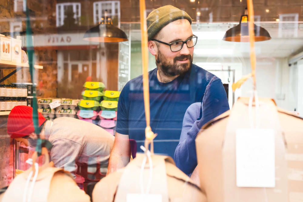 A photo of two men behind a window