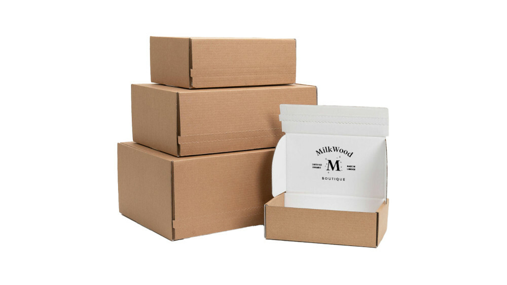 Three boxes piled on top of each other, with one opened box and a logo on the inside