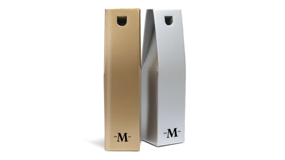 A gold and silver bottle gift box side by side with a printed logo on the front