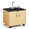 Jonti-Craft Clean Hands Helper Portable Plastic Sink - 26" Counter, a child-sized sink unit with a black countertop, a silver faucet, a soap dispenser, and a light wood cabinet on wheels.