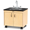 Jonti-Craft Clean Hands Helper Portable Stainless Steel Sink - 26" Counter, a compact mobile sink with a stainless steel basin, black counter top, and light wood cabinet with black handles and wheels.