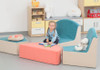 Novum Tulip Soft Furniture Elements, colorful children's lounge furniture with soft cushions and plush toys in a playful nursery setting.