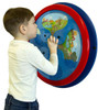 Playscapes Where is Mousy? Round Wall Toy, a young boy interacting with a colorful, circular wall-mounted educational toy for children.