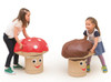 Novum Toadstool Soft Stool & Table for Kids, kids playing with mushroom-shaped soft stools designed as toadstools with smiling faces.