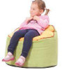 Novum Ladybug Bean Bag Seat, a young girl sitting on a colorful bean bag chair with a soft, plush surface and a ladybug design.