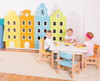 Moje Bambino Cityscape Double Cabinet, colorful children's storage cabinet with a cityscape design featuring buildings and clock elements in a preschool classroom setting.