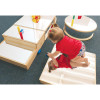 Whitney Brothers Infant Floor Mirror Set Climbing Platform, two young children playing and climbing on the mirror-based activity platform in a classroom setting.