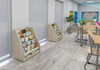 Moje Bambino Bookcase w/Fabric Partitions, wooden bookshelves filled with children's books in a modern, brightly colored children's reading area.