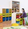 Moje Bambino Feria Premium Medium Cabinet for Gratnell Trays, colorful storage cabinet with multiple trays for organizing toys and educational supplies in a classroom setting.