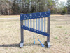 Infinity Playgrounds Chime Wall Activity Center, outdoor children's musical instrument with blue humming panel and metal chimes on a grassy field.