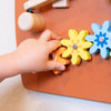 SPARK & WOW Horse Activity Wall Panel Toy, colorful wooden flower-shaped blocks for children to interact with.