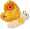 HABA Pro Butterfly Interactive Wall Decor, wooden caterpillar with a smiling face and orange antennae, paired with an orange fabric butterfly wall decoration.
