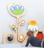 Moje Bambino Meadow with Ladybug Sensory Wall Panel, colorful children's sensory panel with flower, ladybug, and reflective mirror for interactive play and sensory development.