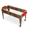 Childbrite Youth Sand and Water Activity Center, a wooden sandbox with clear sides, red plastic containers on each end, and caster wheels for mobility.