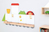 Moje Bambino Toddler Train Magnetic Board Set, colorful magnetic train with various animal and garment magnets on a white wall.