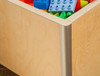 Playscapes 3-Branch Pinwheel Triple Discovery Table, close-up of the wooden storage bin filled with colorful building blocks in blue, red, green, and yellow.