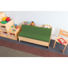 Whitney Brothers Comfy Reading Center Couch, child-friendly wooden sofa with green cushioned seat in a children's reading nook with books and toys nearby.