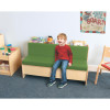 Whitney Brothers Comfy Reading Center Couch, green cushioned kid's sofa with a young boy sitting and smiling in a playroom or classroom setting