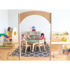 Whitney Brothers Nature View Pond Children's Table, children playing around a wooden table in a bright playroom.