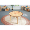 Whitney Brothers Nature View Live Edge Round Table 18" H, wood table with a natural live edge design, situated in a children's classroom setting.
