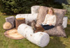 Playscapes Woodsmen Naturescape Mini Lounger, outdoor garden seating made of realistic wood-look logs and stumps for natural aesthetic and comfortable relaxation.