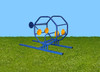 Playtime Playground Equipment Helicopter Outdoor Climber, blue metal playground helicopter climber with yellow wheels on green grass under a clear blue sky.