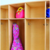 Whitney Brothers Five Section Coat Locker, wooden cubby-style storage with hooks and colorful children's backpacks hanging inside.