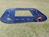Infinity Playgrounds Daytona Square Trike Track Path, a black miniature road track for kids with colorful trikes and bikes on a grassy field.
