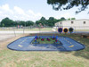 Infinity Playgrounds Daytona Square Trike Track Path, colorful tricycles on a rubberized play area with a winding road design for kids' riding fun.