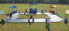 Infinity Playgrounds Formula One Road Course Trike Track, children playing on a miniature road course with race station and road signs