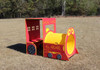 Infinity Playgrounds Infinity Express Caboose Outdoor Climber, colorful red and yellow train-themed playground equipment on grass field.