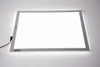TickiT Ultra Bright LED Light Panel, white rectangular lighting panel with illuminated border and power cord, ideal for photography or video shoots.