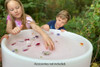 TickiT Sensory Mood Discovery Light Table, children playing with sensory toys in an outdoor setting.
