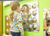 SPARK & WOW Acrylic Bubble Mirror - 16 Large Bubbles, a mirror with 16 spherical acrylic bubbles reflecting a child's face and playroom.