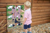 SPARK & WOW Acrylic Bubble Mirror - 9 Giant Bubbles, kid admiring the reflective bubble mirror with multiple reflections of himself outdoors.