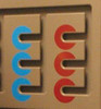 Playscapes Spindle Match Small Ambient Activity Wall Panel, close-up view of twin beige panels with one blue and one red spindle maze each.