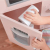 Teamson Kids Little Chef Westchester Retro Pink Play Kitchen, child_imagining_playing_with_pretend_microwave_and_refrigerator