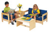 Jonti-Craft Living Room Coffee Table, wooden child-sized coffee table with a light finish and open storage space underneath, positioned between two sofas as part of a children's playroom furniture set.