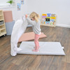 Children's Factory Nap Time Rest Mats, Elements - Set of 5, girl unfolding or setting up a pink and white rest mat in a classroom or nursery setting.