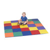 Children's Factory Patchwork Activity Play Mat, Rainbow, colorful foam play mat with a young child sitting on it, enjoying playtime.